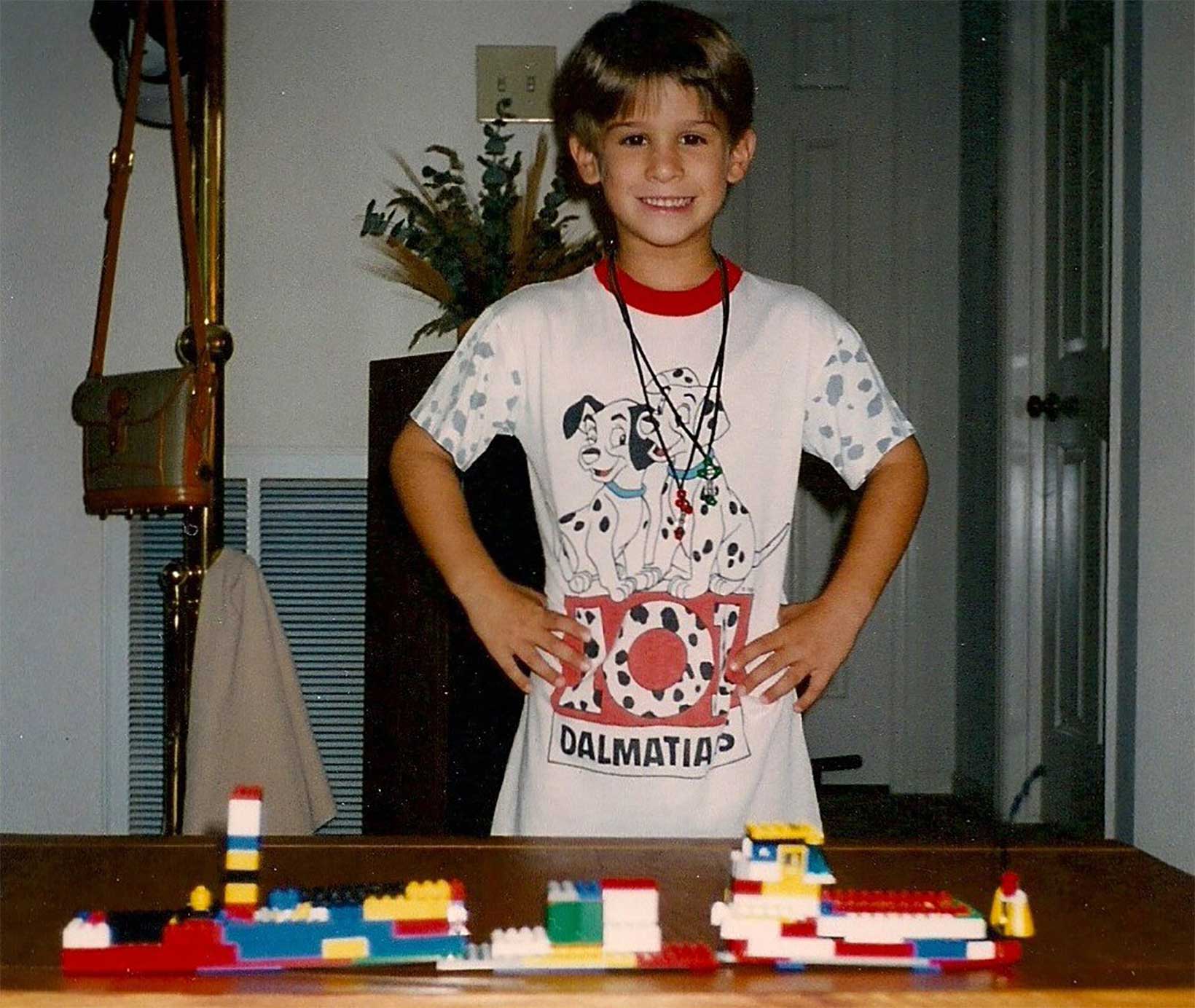 Tristan Mace as a young child with Legos